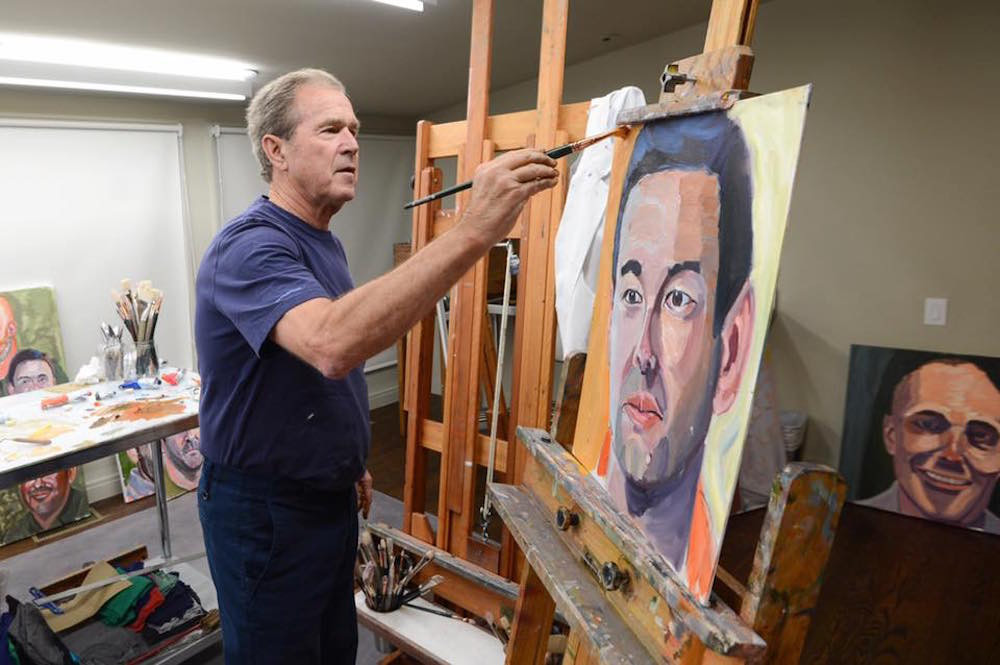 George W. Bush paints one of the works in his “Portraits of Courage” art exhibit. The paintings are on display at Wonders of Wildlife through July 5.